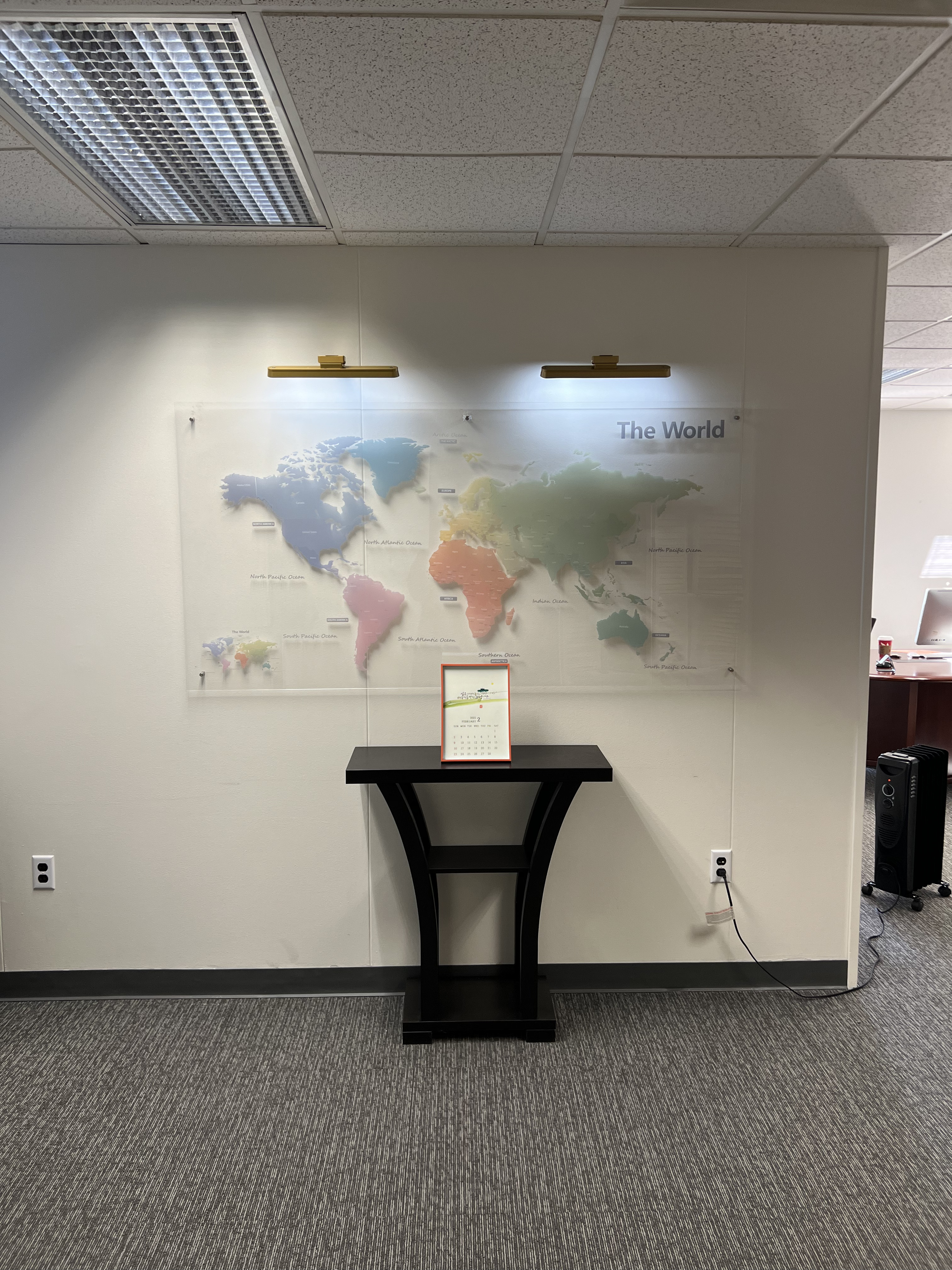BBELL office wall with world map and entry table